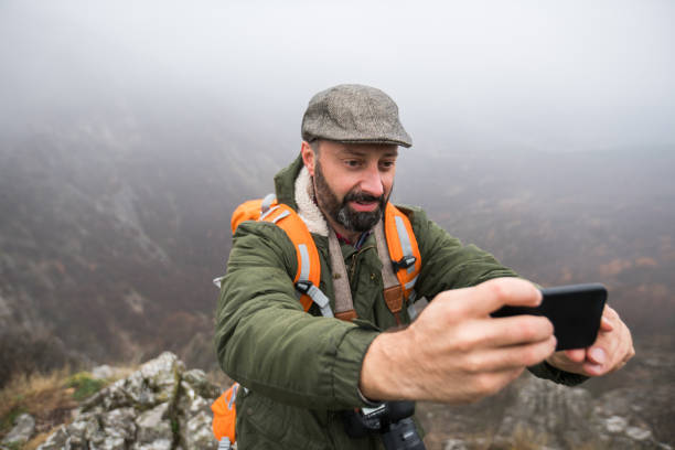 istock Selfie from the mountain top 889464250