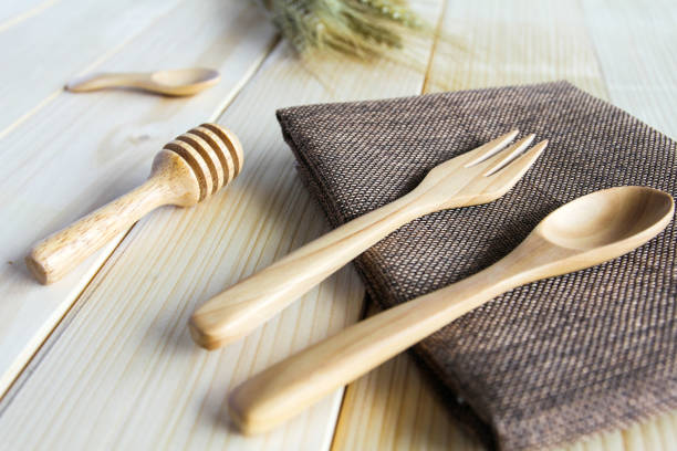 istock Wooden kitchen utensils on wooden background 889466924
