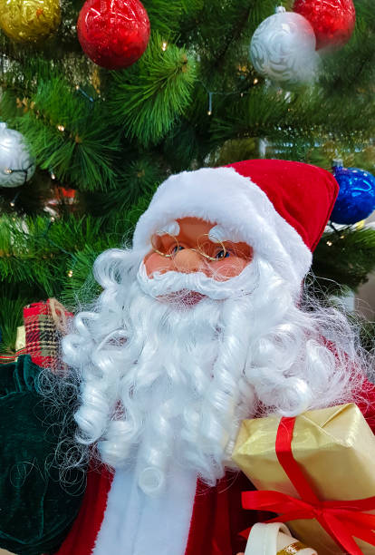 istock santa claus toy christmas tree 889469840