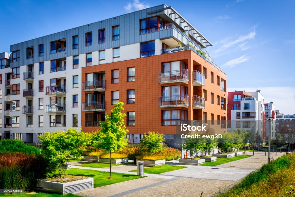 Walkway leading along the new colorful cmplex of apartment buildings Walkway leading along the new colorful cmplex of apartment buildings, Gdansk, Poland Apartment Stock Photo