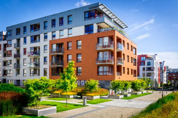 Photo of Walkway leading along the new colorful cmplex of apartment buildings