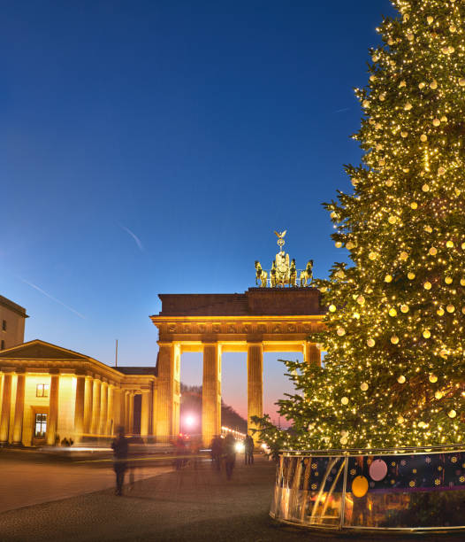 istock Brandenburger Gate in Berlin with Christmas tree at night 889473146