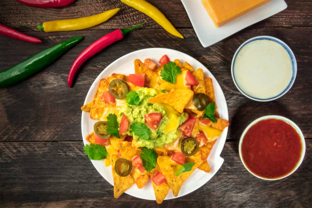 istock Nachos with cheese, traditional Mexican snack, with ingredients 889473208