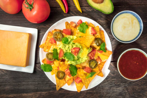 istock Nachos with cheese, traditional Mexican snack, with ingredients 889473298