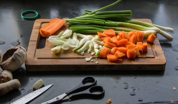 istock Carrot onion and mushrooms on cutting board. 889476544