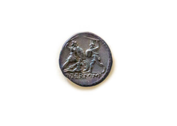 istock Roman Aes coin depicting Gladiators fighting 889486940