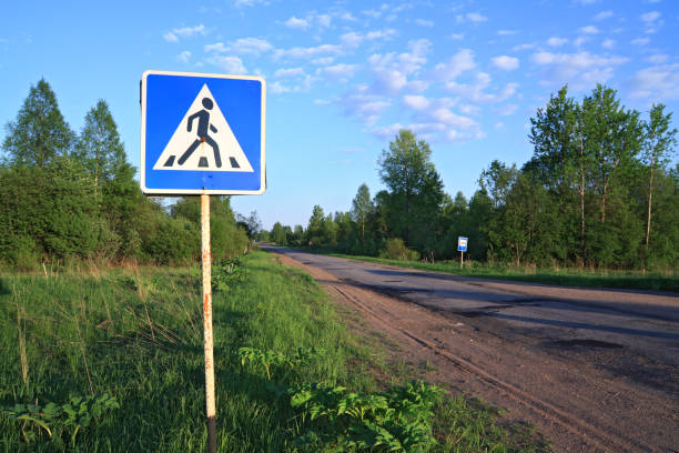 istock road sign near asphalt road 889491306
