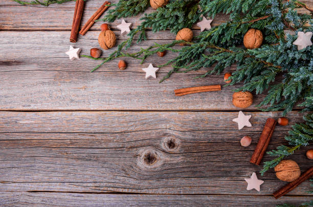 istock Christmas tree and nuts on wooden boards. 889496596