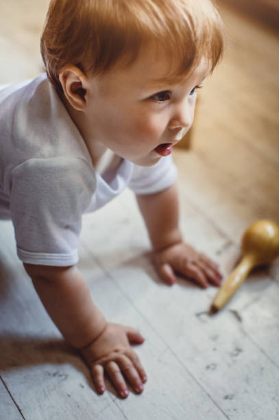 istock Baby Boy Crawling on Floor 889504184