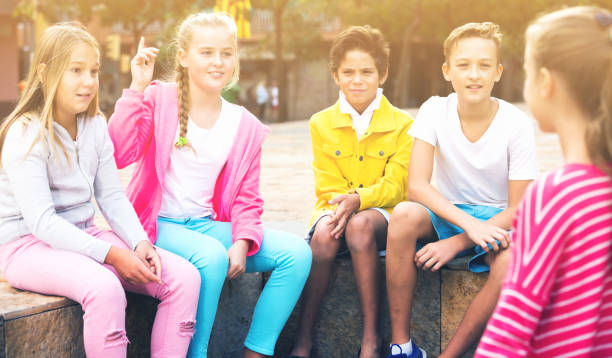 istock Five kids are communicating about football on walk 889512946