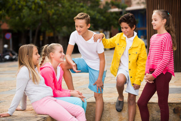 istock Five kids are communicating about football on walk 889512954