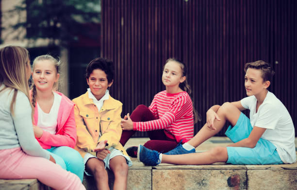 istock Five kids are communicating about football on walk 889512982