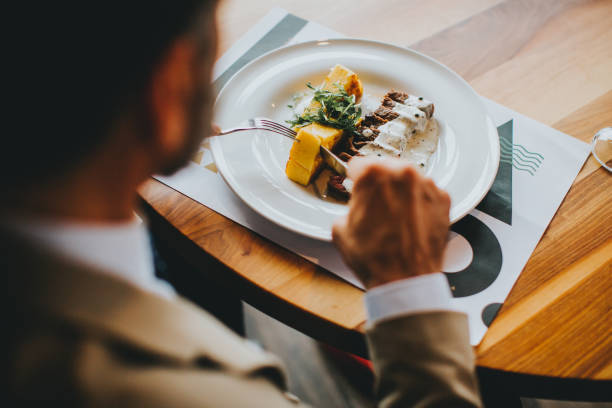 istock Handsome businessman having lunch wine in restaurant 889516656