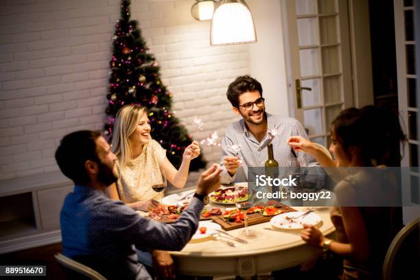 Young People Celebrating New Year And Drinking Red Wine Stock Photo - Download Image Now