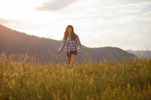 istock Happy girl on a mountain meadow 889516854