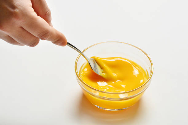 istock Male Hand Mixing Eggs in Bowl 889521352