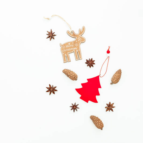 istock Christmas tree decoration, anise stars and cones on white background. Flat lay, top view. Christmas or New year concept 889521418