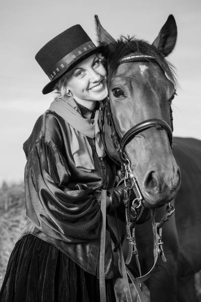 istock young woman embracing horse 889522330