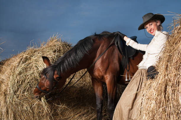 istock young woman embracing horse 889522338