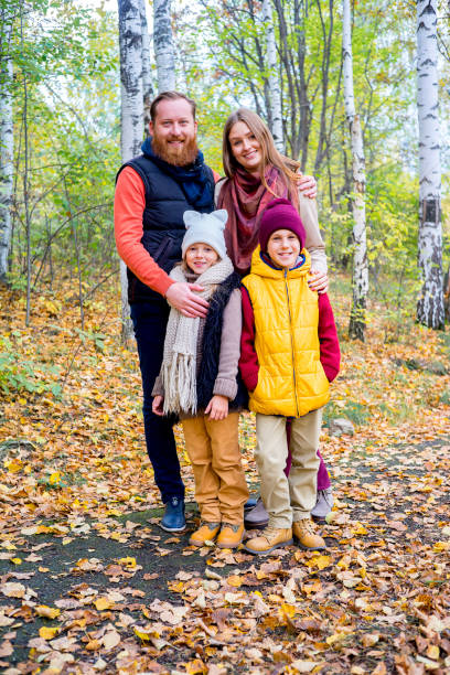 istock Family in an autumn park 889524944