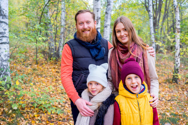 istock Family in an autumn park 889525022