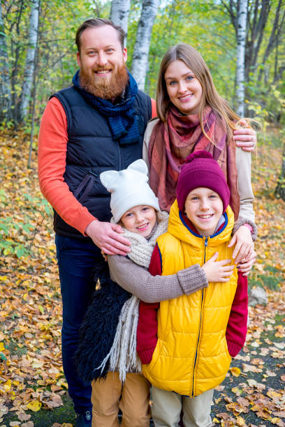 istock Family in an autumn park 889525100