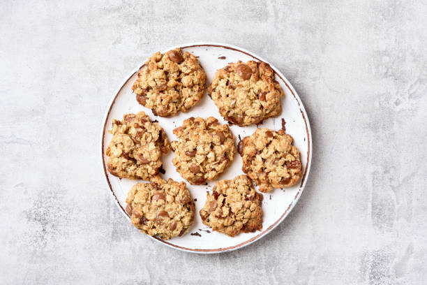 Oats cookies Oats cookies on plate over gray stone background. Top view, flat lay chocolate chip cookie top view stock pictures, royalty-free photos & images