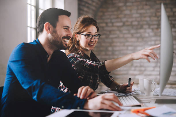 istock Coworking and corporate colleagues working in office 889534052