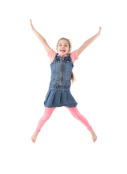 istock young girl jumping 889534378