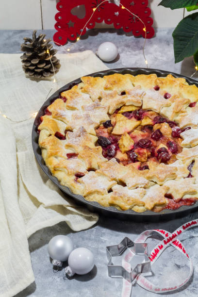 istock Apple cranberry pie. White and red background. Christmas decoration. 889534410