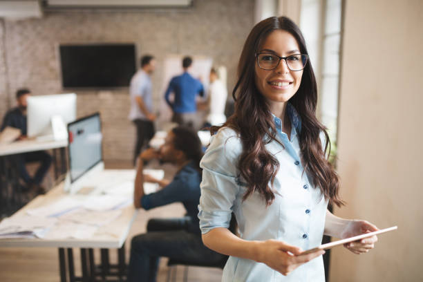 istock Beautiful woman working in  modern office 889536810