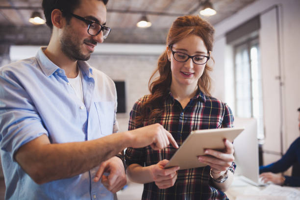 istock Company coworkers working in office 889537506