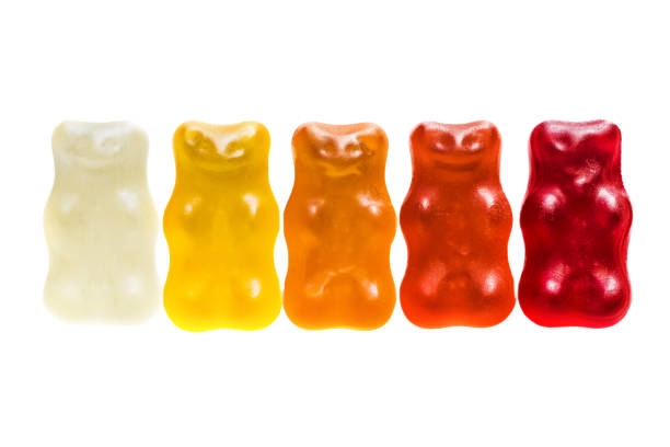 Multi colored gummy bears candy on white
