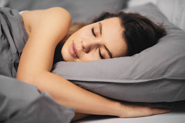 istock Girl lying down in bed 889548448