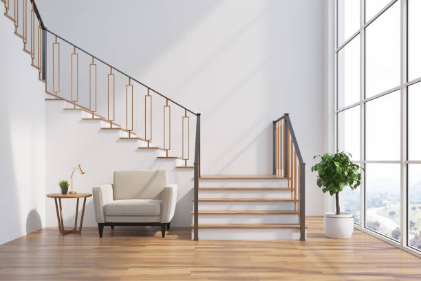 White living room interior, stairs, armchair