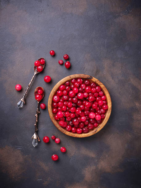istock Fresh ripe cranberry in wooden bowl 889550086
