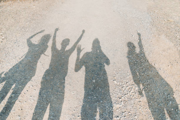 istock Shadows of happy people. 889552360