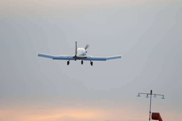 istock Low Angle View Of Airplane Flying Against Sky 889556978