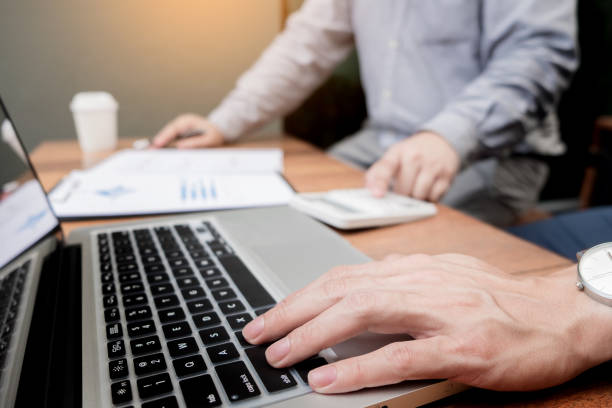 istock Business People Discussing Over Document In Meeting At Office 889565172