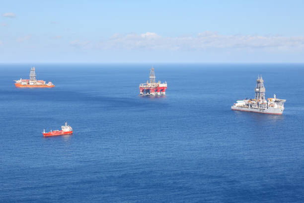istock an oil platform surrounded by tankers 889565634