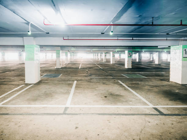 istock automatic technology check for empty area of car parking in shopping mall with red fire extinguisher no the wall 889570140