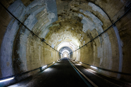 A bike road tunnel taken with fisheyes.