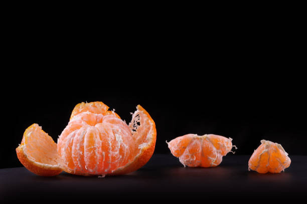 istock ripe juicy peeled mandarin orange 889577128