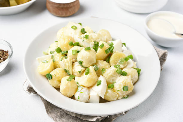 istock Potato salad with eggs and green onion 889577292