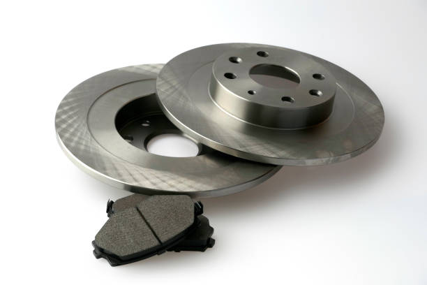 istock New car brake disc and brake linings on white background 889581866