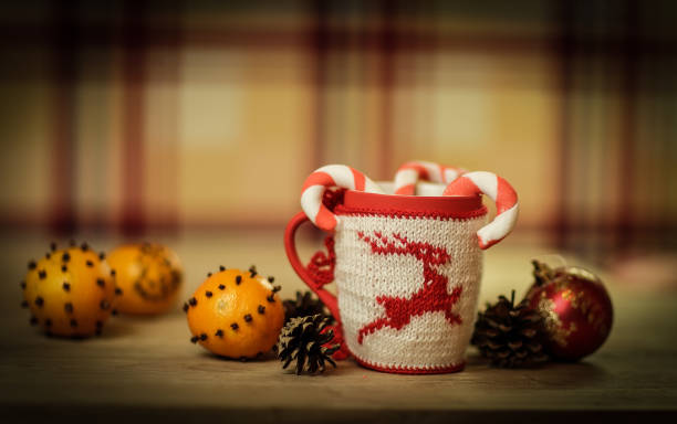 istock Christmas Cup and oranges on wooden background blurred 889582042