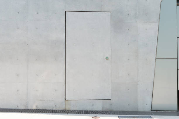 istock sidewalk by street wall & door 889595140