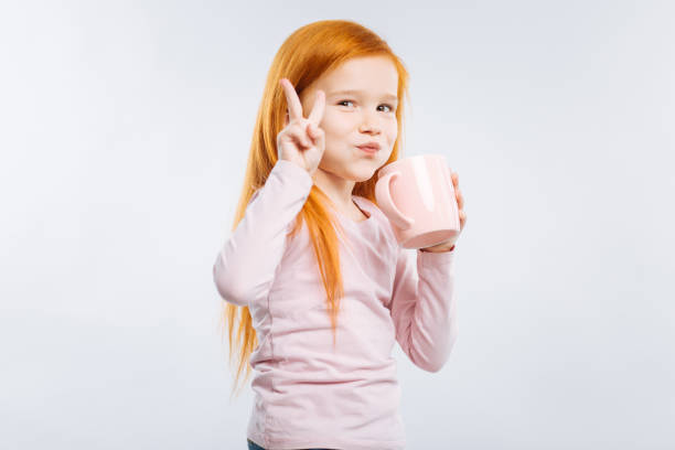 istock Cheerful girl drinking tasty tea 889597846