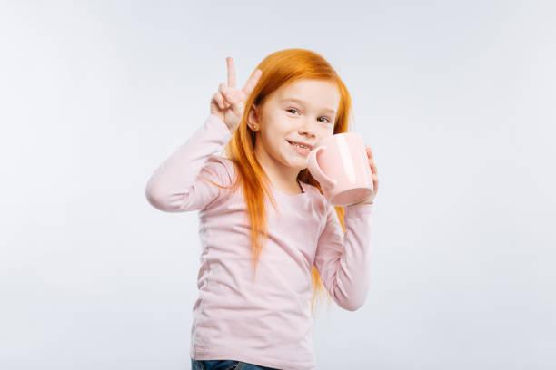istock Amazing child showing victory sign 889598090