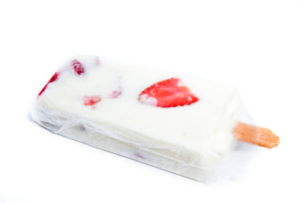 Strawberry flavored ice popsicle with cream, white background